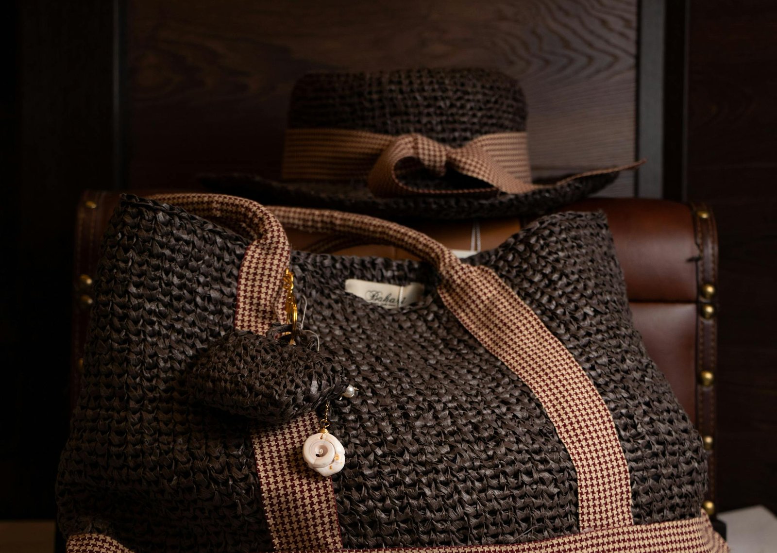 Stylish brown woven bag with matching hat, perfect for fashion-forward accessories.