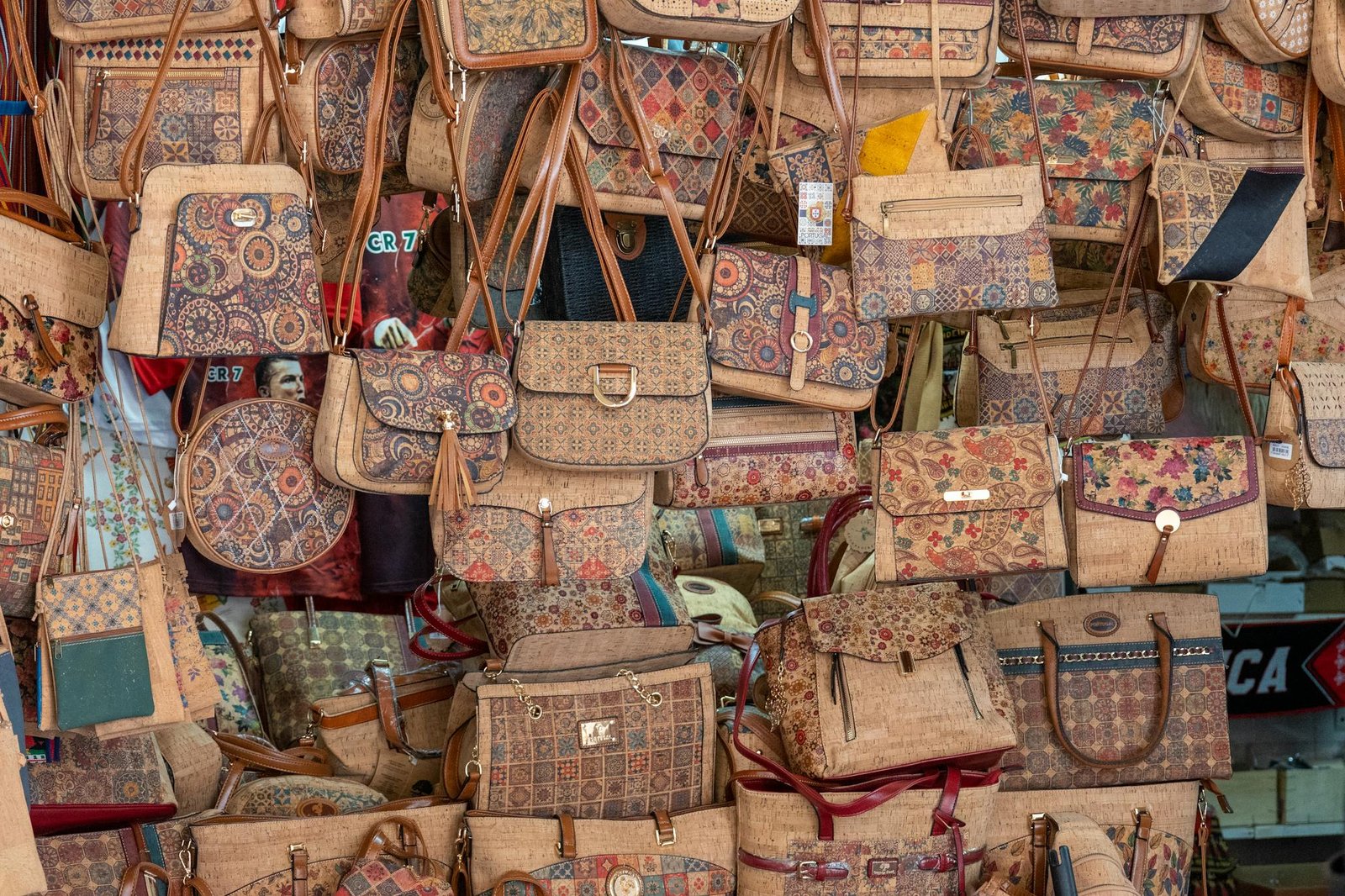 Vibrant selection of handmade patterned bags showcasing intricate designs at a local market.